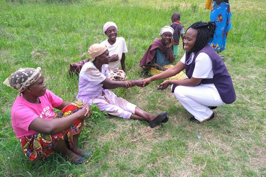 Nurse Carol during a community outreach Nurse Carole saluting women during a community outreach, Zambia